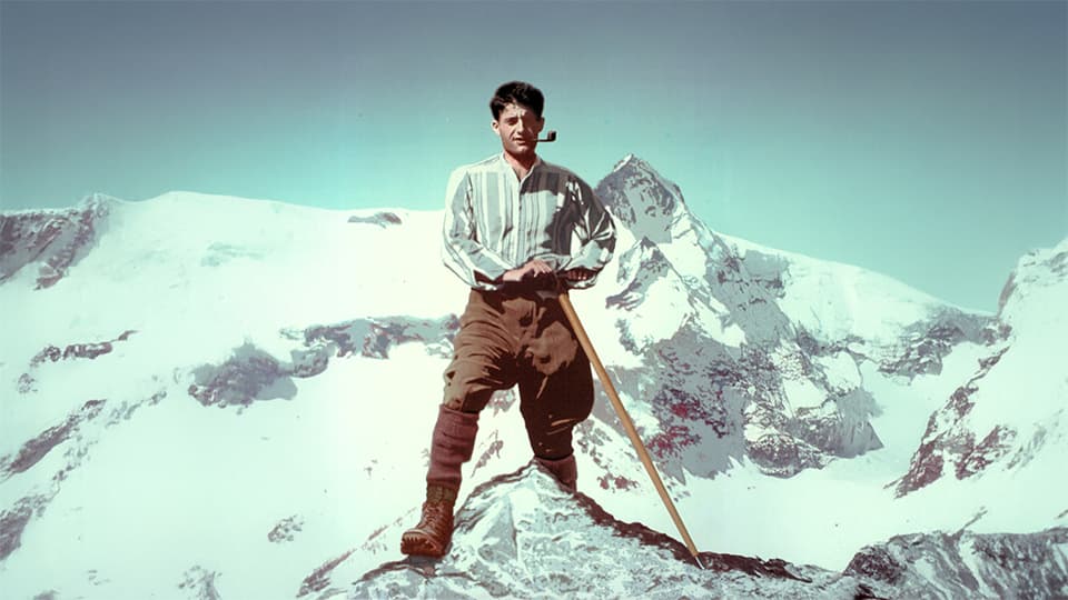 St. Pier Giorgio Frassati standing at a mountain summit